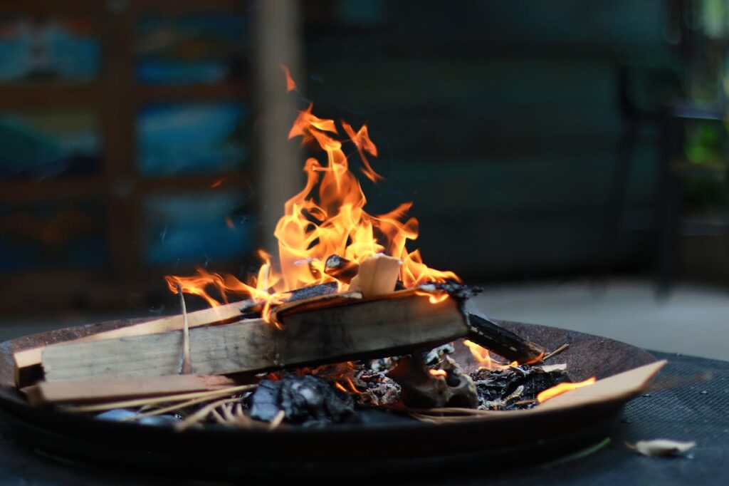A vibrant flame in an indoor fire pit, perfect for warmth and ambiance.